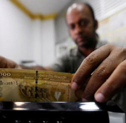 Currency: LKR-USD selling rate crosses Rs. 324